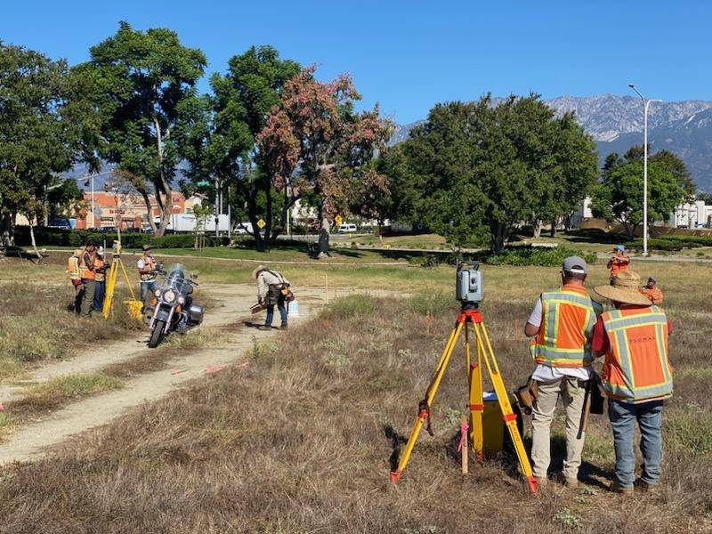 Tim Ralls, a graduate of Santiago Canyon College’s surveying apprenticeship program, works with a field crew conducting land surveying activities. Ralls completed the program and now works in the industry while also teaching in the same program that helped launch his career.
