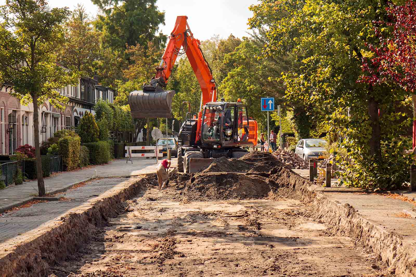 digger truck digging up dirt for construction