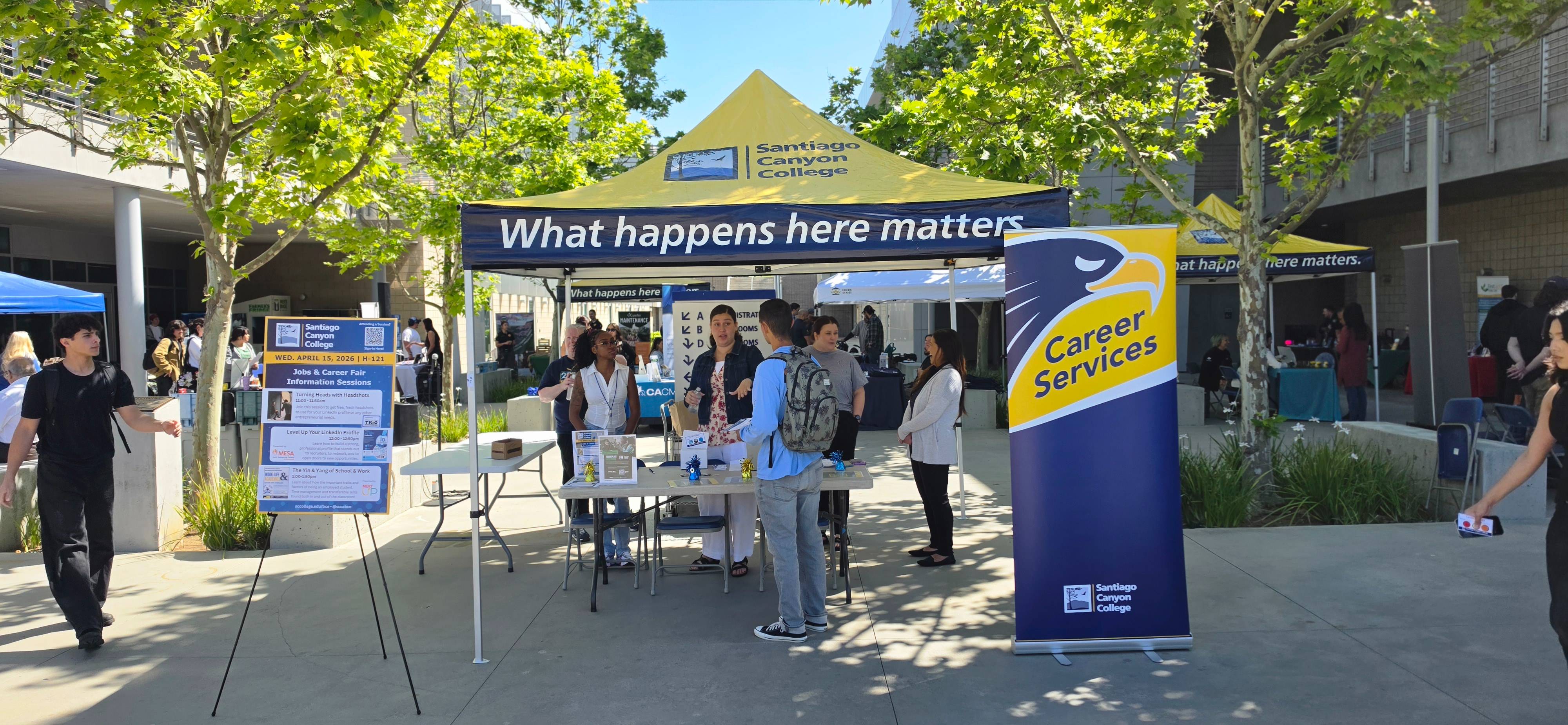 Students gather at the Career Services booth during the Santiago Canyon College Career Fair on April 15 at Vazquez Promenade in Orange, Calif. The event offered resources, information sessions, and connections to more than 50 local employers.