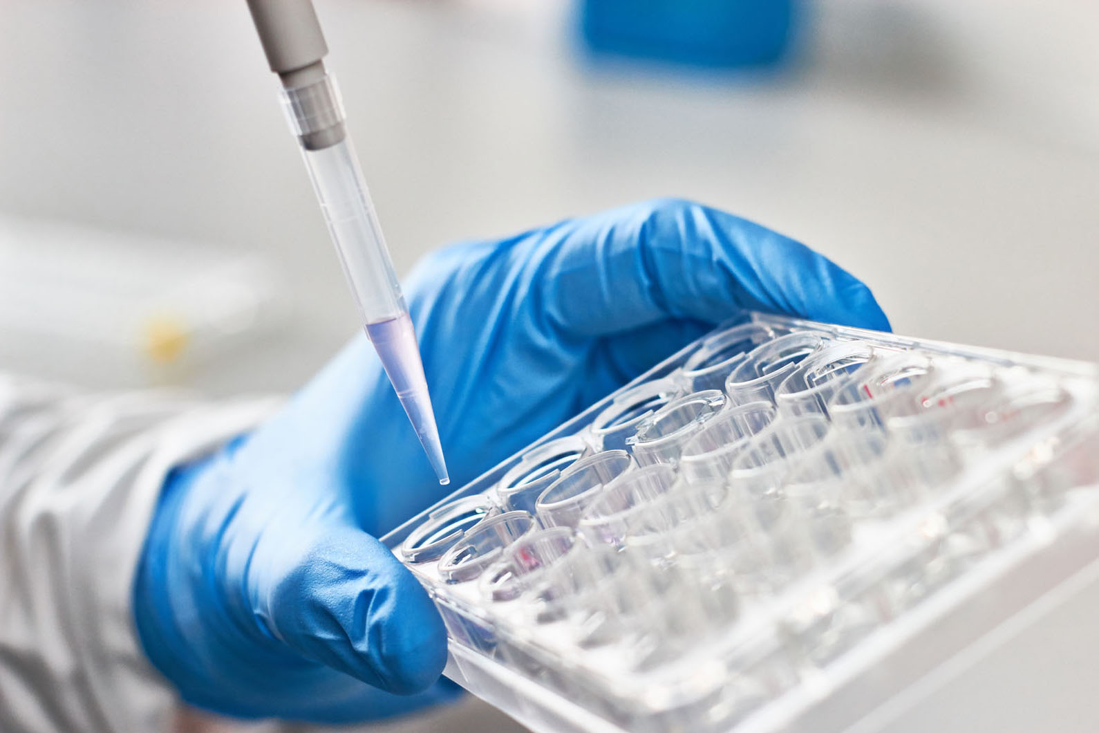 bio tech with a sample case and pipette